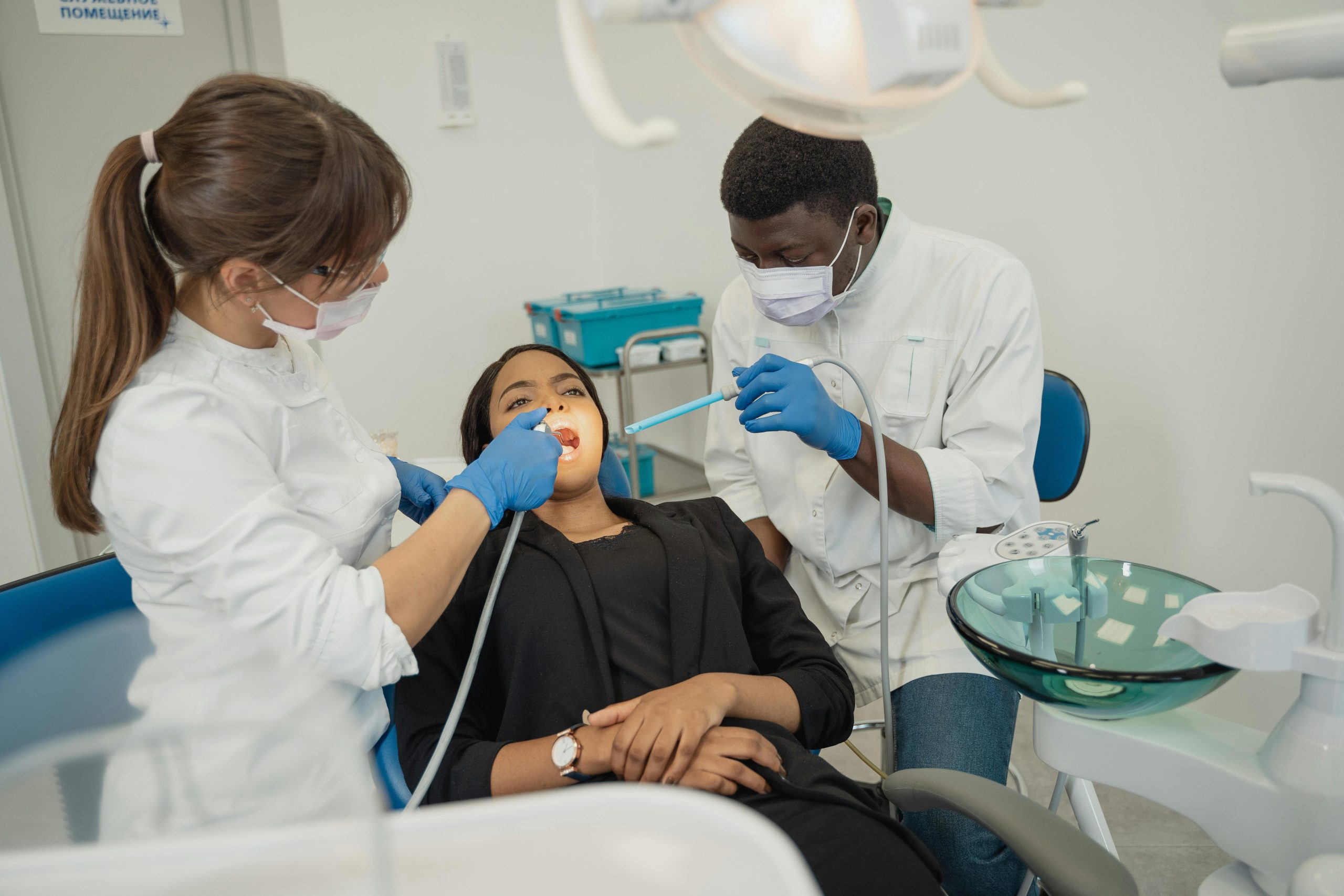 patient having an appointment with two dentists